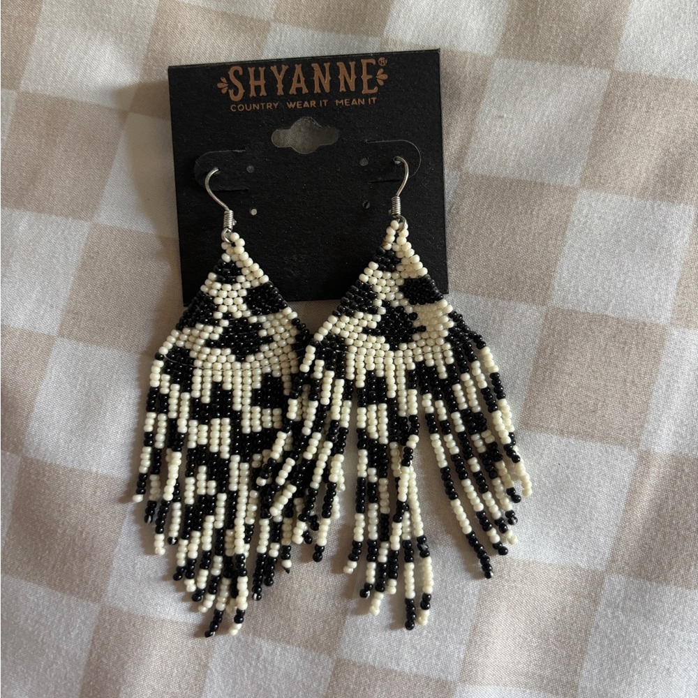 Cow print beaded dangle earrings